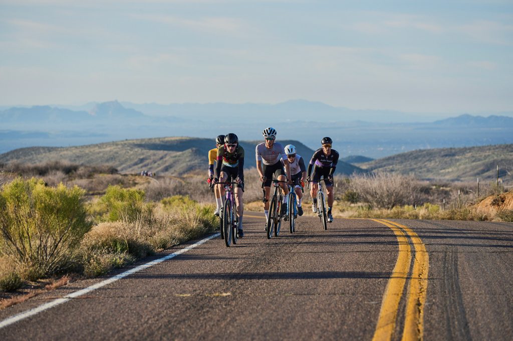 6 Cyclists racing through the Arizona Desert.