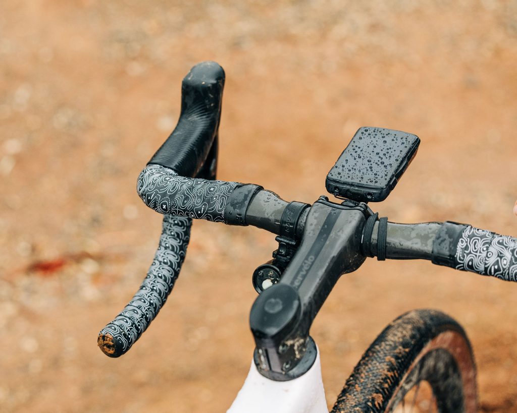The handlebars of the bike, with Burgh Ossa White bar tape.