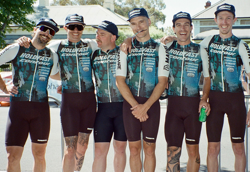 A group of riders in their new branded green/blue kit.